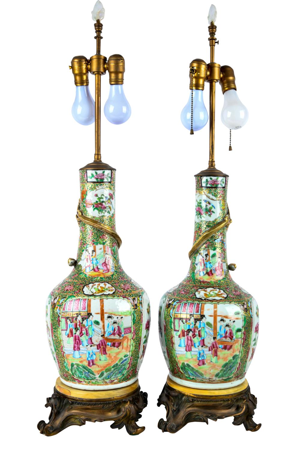 Appraisal: PAIR OF CHINESE FAMILLE ROSE PORCELAIN VASESmounted and electrified as