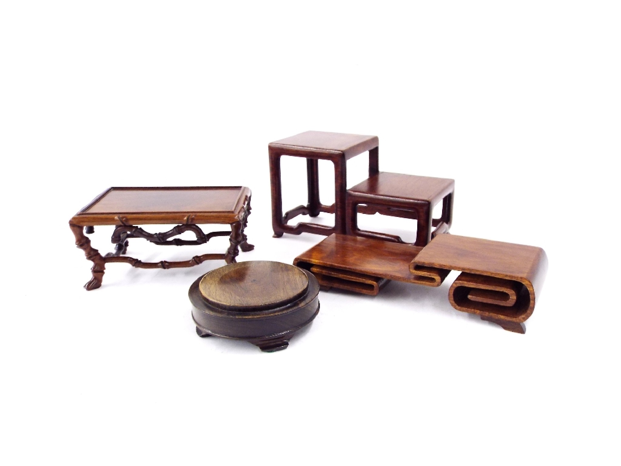 Appraisal: Four Oriental hardwood stands of various forms the largest high