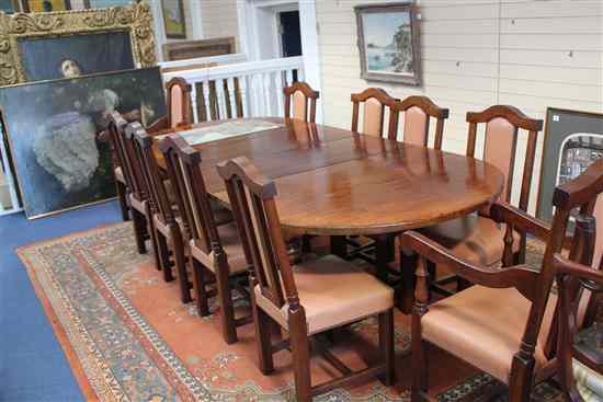 Appraisal: A late th century style oak extending dining table on