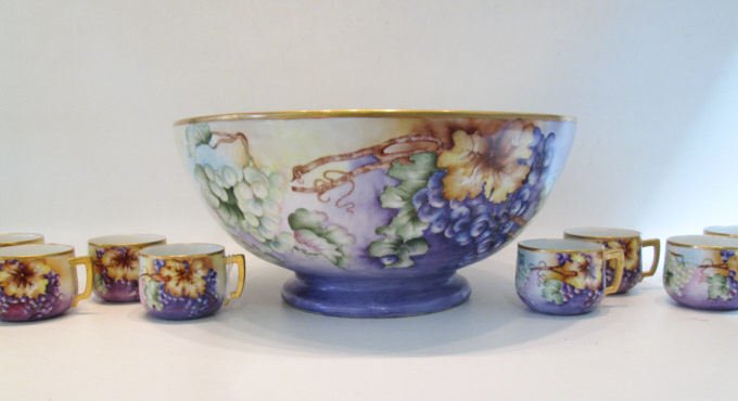 Appraisal: HAND PAINTED PORCELAIN PUNCH BOWL AND CUPS the bowl with