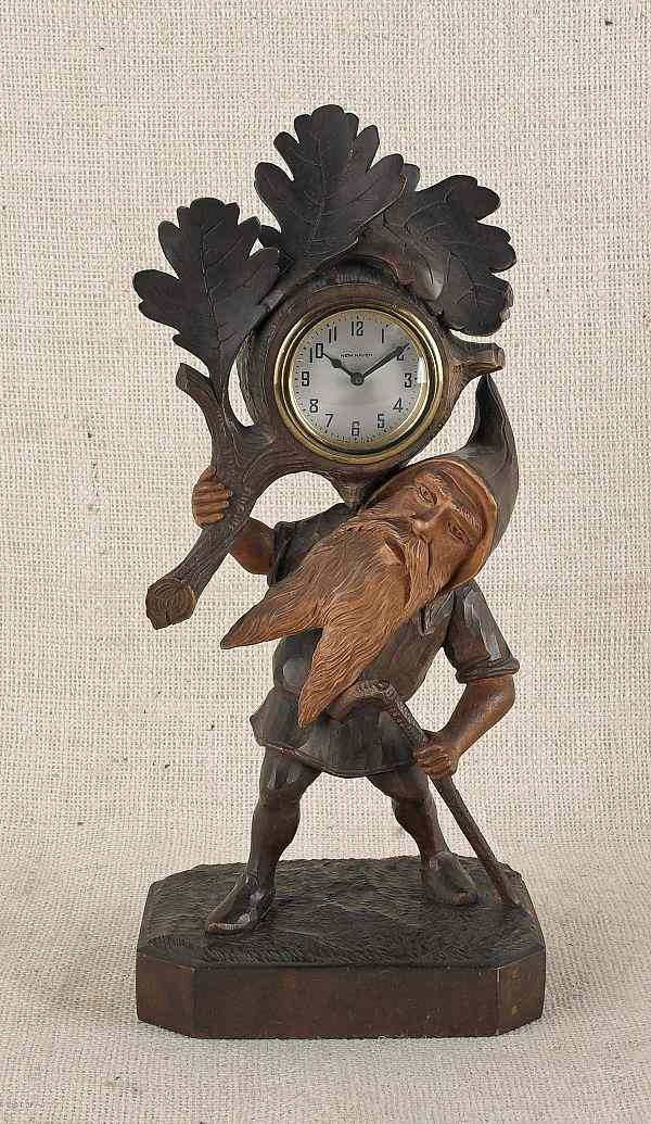 Appraisal: Black Forest carved gnome shelf clock ca h