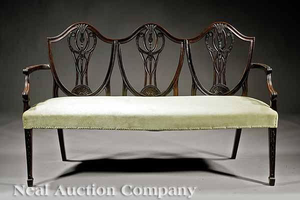 Appraisal: A Federal-Style Carved Mahogany Settee triple shield back carved with