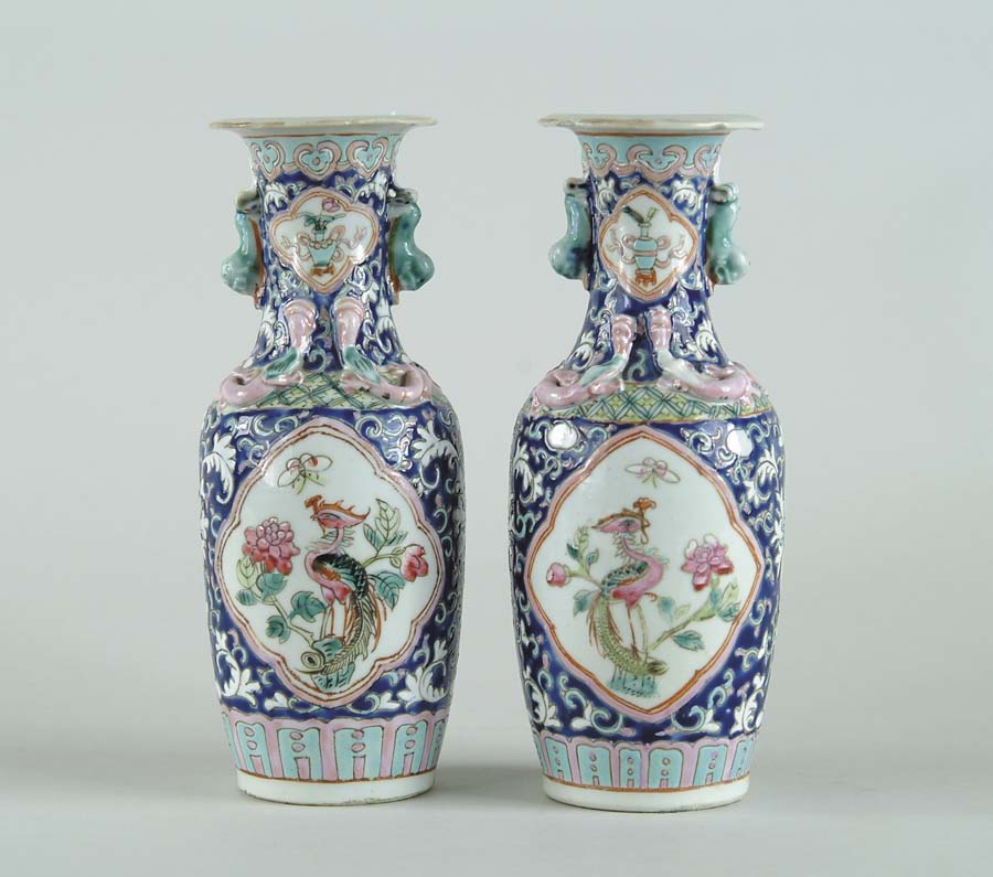 Appraisal: PAIR OF SMALL DECORATED ORIENTAL VASES Vases decorated with two