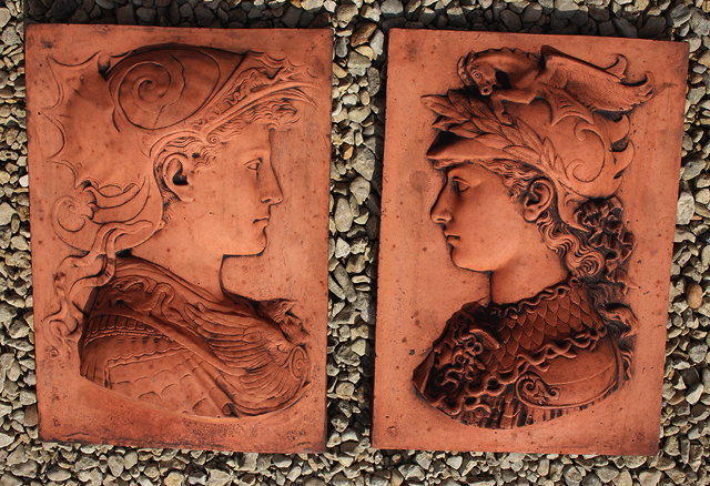 Appraisal: A PAIR OF TERRACOTTA PLAQUES depicting relief profile busts of