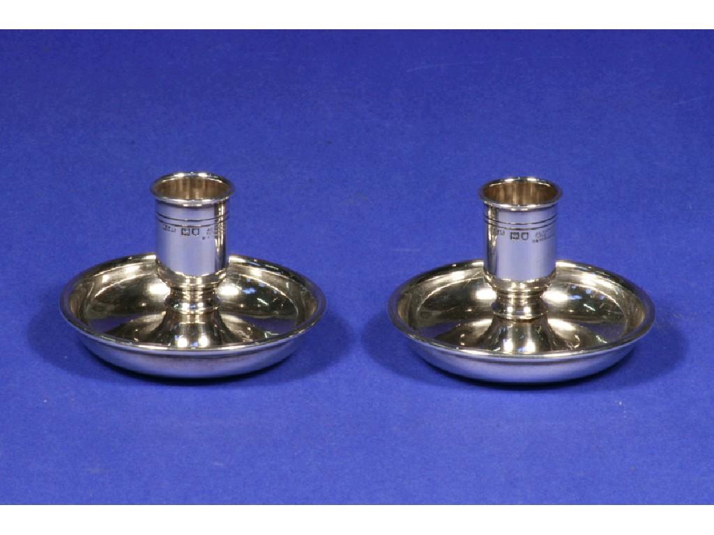 Appraisal: A PAIR OF LATE VICTORIAN TRAVELLING MINIATURE CHAMBERSTICKS with detachable