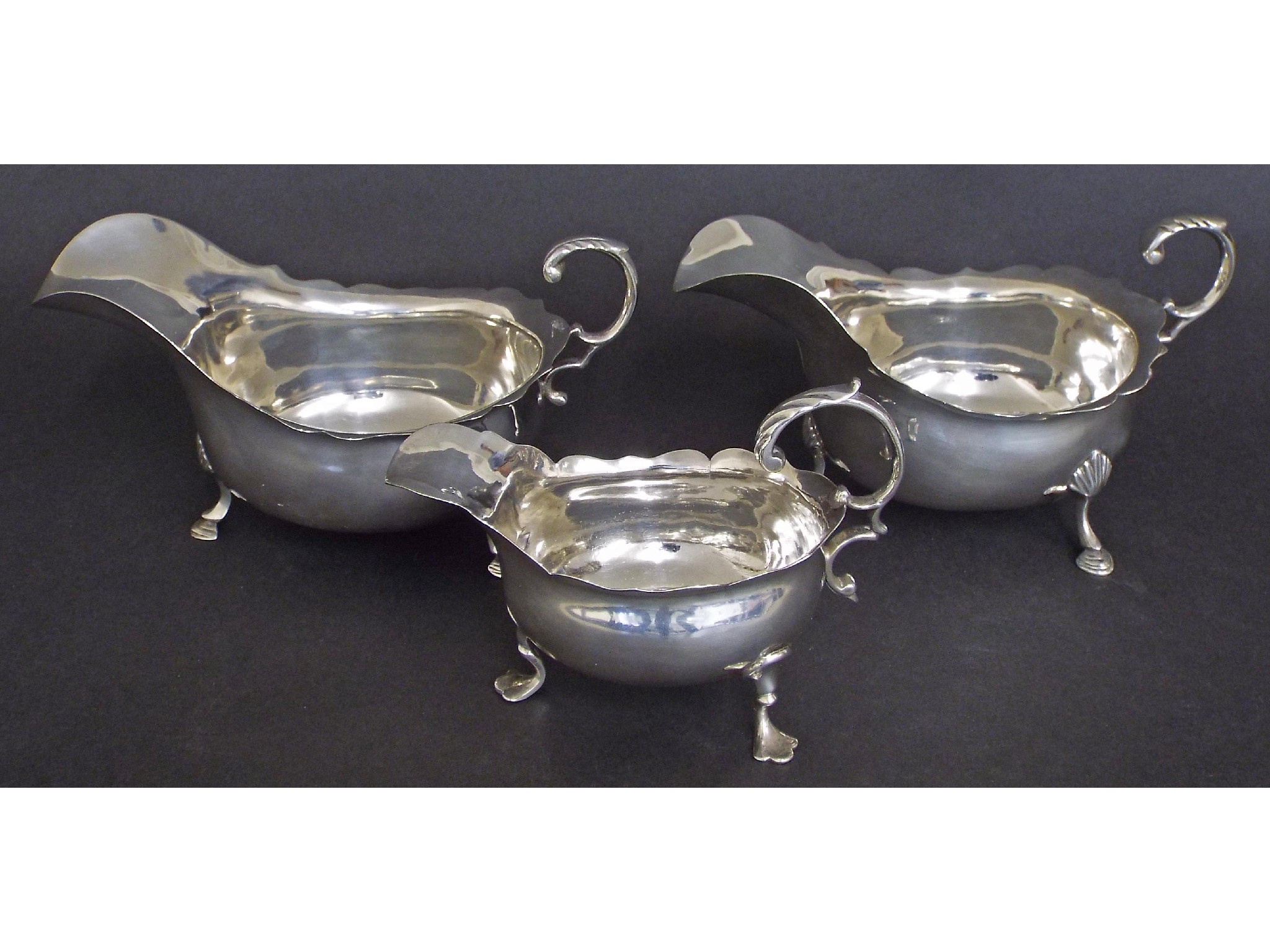 Appraisal: Pair of Georgian style silver sauce boats maker Williams Limited