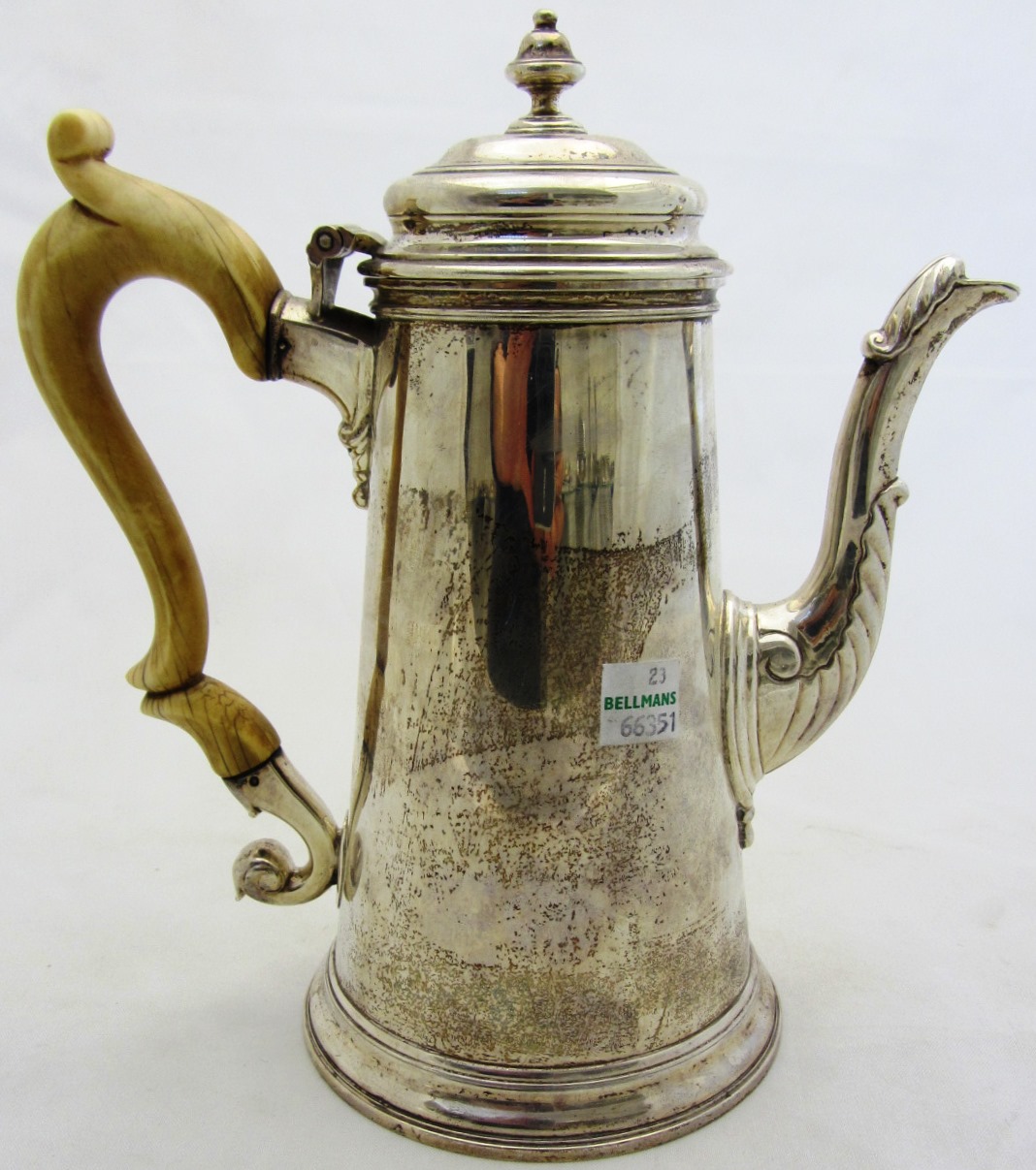 Appraisal: A silver coffee pot of plain tapering cylindrical form and