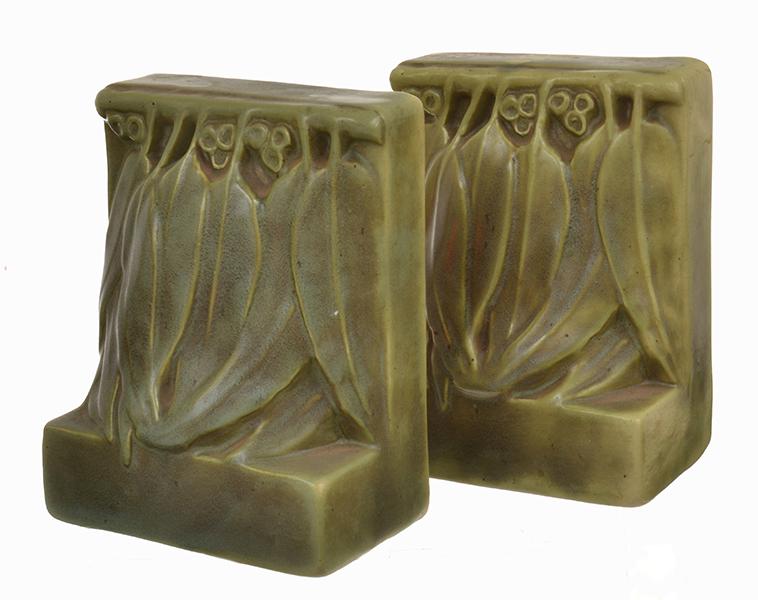 Appraisal: MELROSE WARE FIGURAL BOOKENDS WITH GUMNUT AND LEAF DECORATION