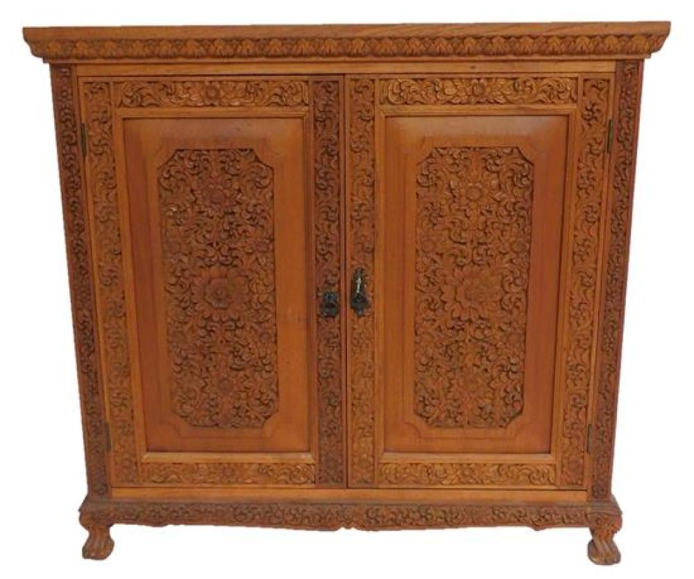 Appraisal: ASIAN Indonesian cupboard with floral carved side panels and hinged