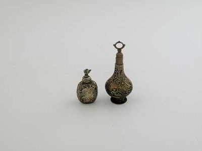 Appraisal: Two decorative scent flasks one oviform with a swan finial