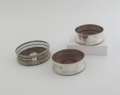 Appraisal: A pair of modern wine coasters with wooden bases by