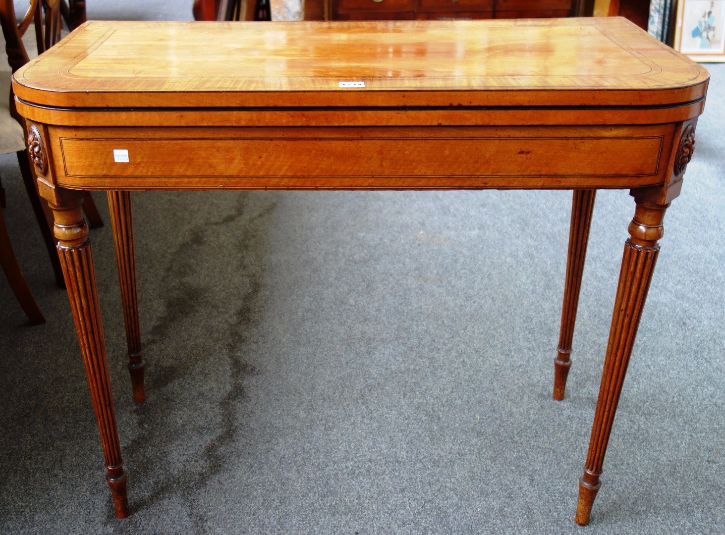 Appraisal: A mid th century style mahogany banded satinwood card table