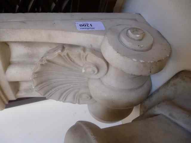 Appraisal: A PAIR OF MARBLE CORBELS of scrolling form high