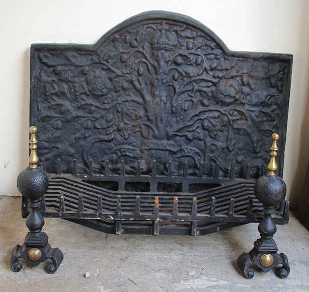 Appraisal: A LARGE CAST IRON FIREBACK with foliate decoration and initials