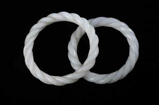 Appraisal: TWO CHINESE WHITE JADE TWISTED BANGLES - Inside in diam