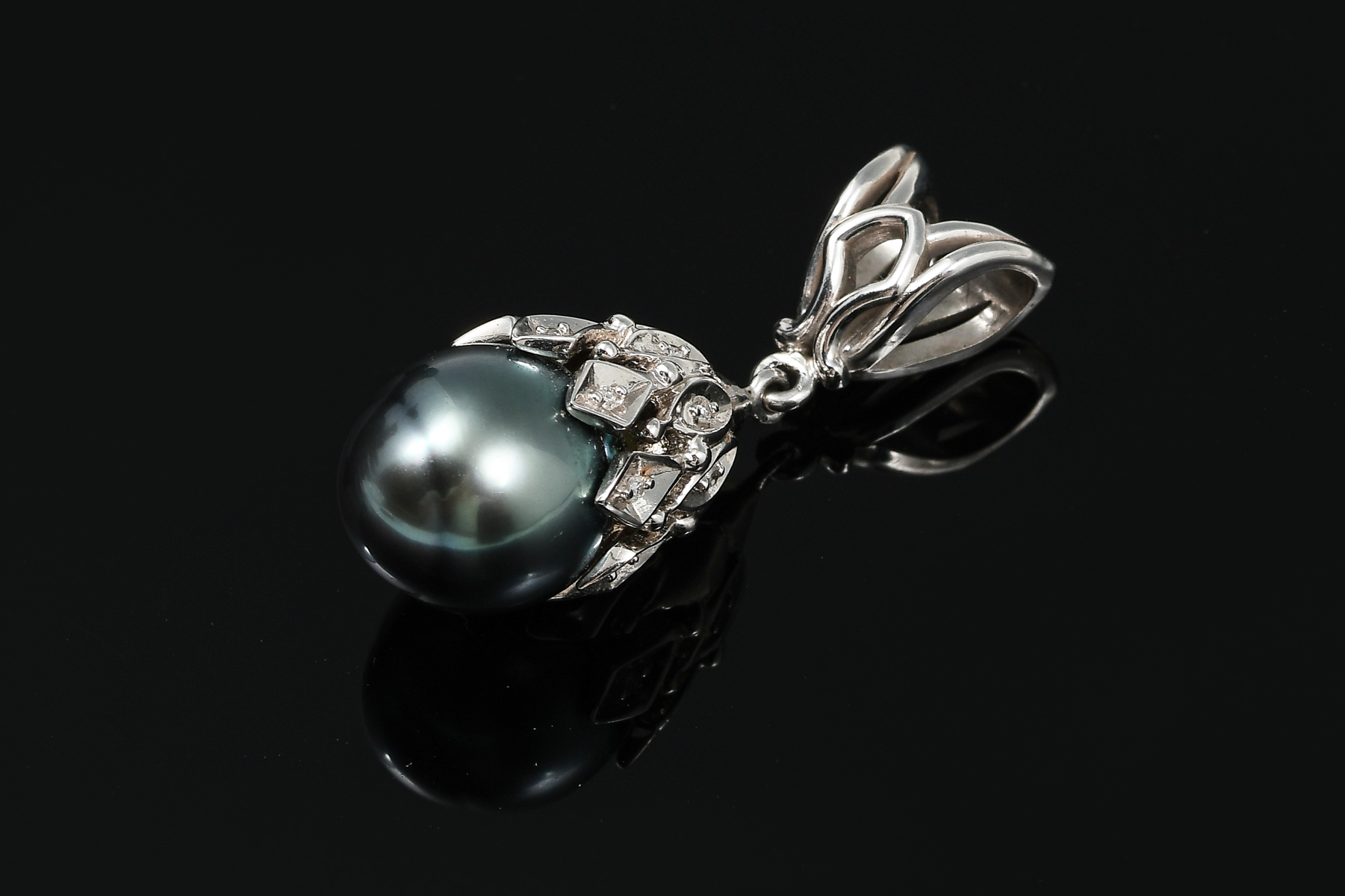 Appraisal: K BLACK CULTURED PEARL AND DIAMOND PENDANT K white gold