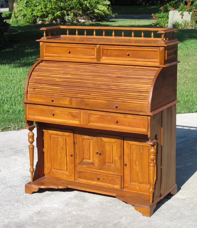 Appraisal: CHESTNUT ROLL TOP DESK Top gallery over half drawers Roll