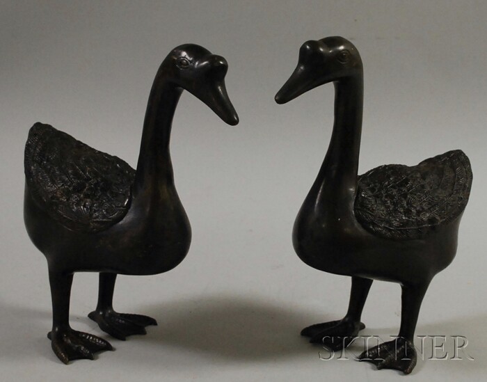 Appraisal: Pair of Asian Patinated Bronze Geese Figures ht in