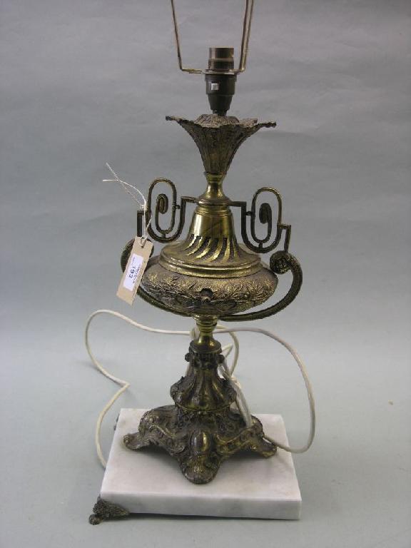 Appraisal: A gilt brass table lamp in rococo style marble plinth