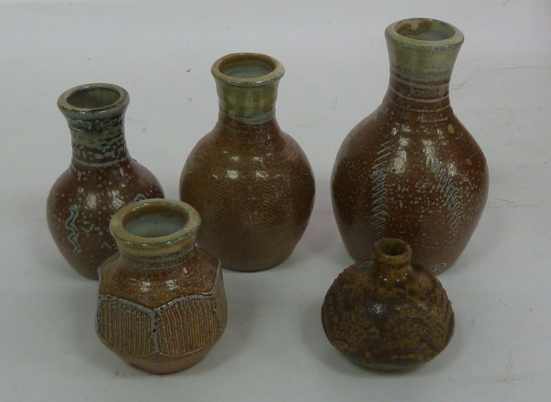 Appraisal: Winchcombe Pottery Four vases cm high and smaller and another