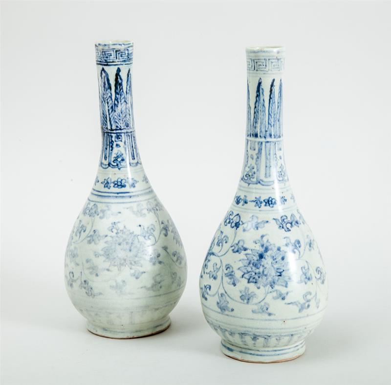 Appraisal: TWO SIMILAR VIETNAMESE BLUE AND WHITE PORCELAIN BOTTLE VASES Unmarked