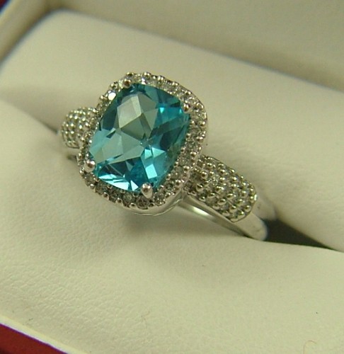 Appraisal: BLUE TOPAZ DIAMOND FOURTEEN KARAT WHITE RING centering a briolette