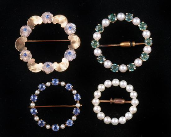 Appraisal: FOUR K YELLOW GOLD AND ASSORTED GEMSTONE CIRCLE PINS One