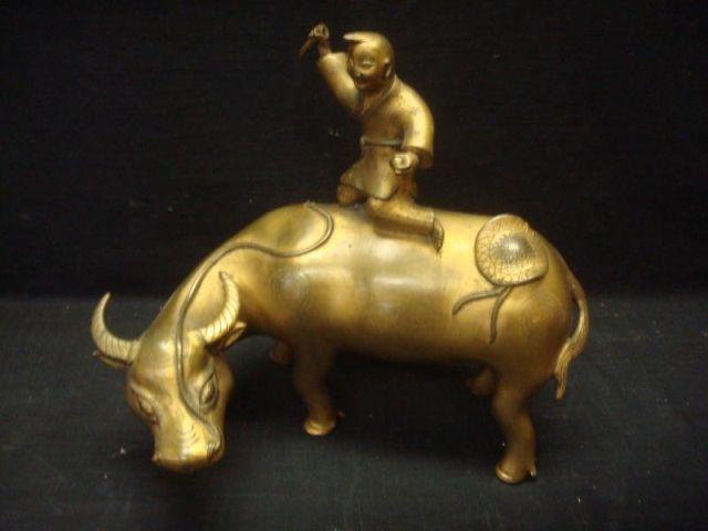 Appraisal: Asian Gilt Metal Bull with Rider Possibly bronze From an