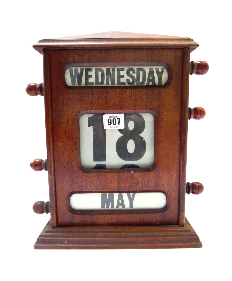 Appraisal: An Edwardian mahogany desk calendar of large proportions cm high