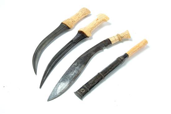 Appraisal: FOUR KNIVES Nineteenth- th century Two Middle Eastern with bone