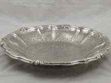 Appraisal: A large white metal tests silver open bowl with chased