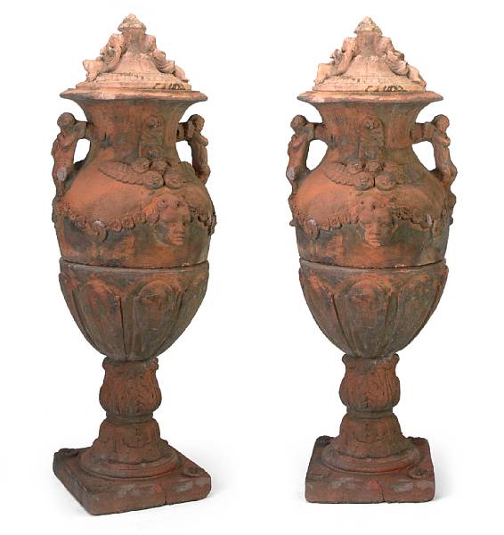 Appraisal: A pair of French terracotta covered urns In three sections