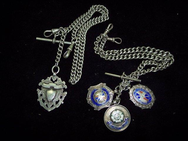 Appraisal: A silver watch chain hung sundry football medals including Rowington