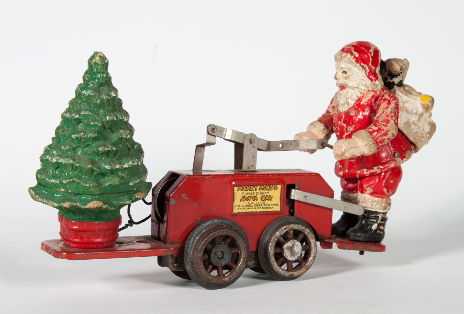 Appraisal: Lionel Mickey Mouse and Santa hand car circa s wind-up