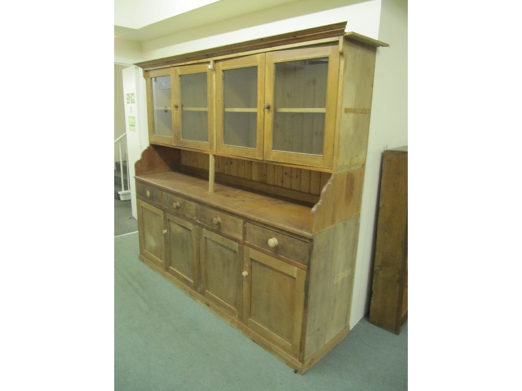 Appraisal: Victorian pine glazed four door cabinet on cupboard base