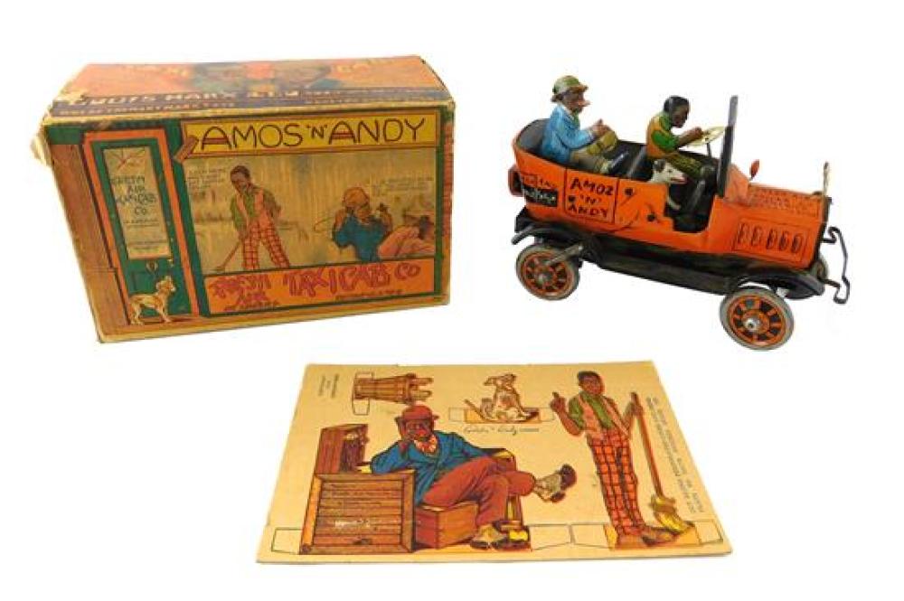 Appraisal: BLACK AMERICANA Boxed Amos Andy Fresh Air Taxi tin wind-up