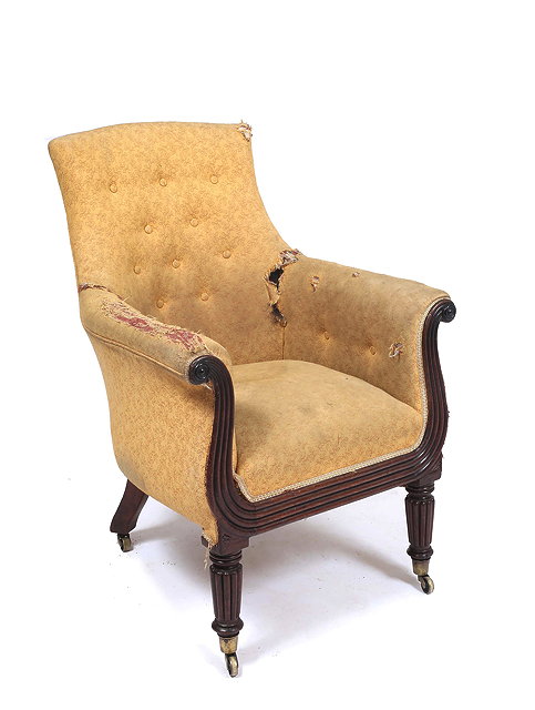 Appraisal: A WILLIAM IV BUTTON UPHOLSTERED LIBRARY CHAIR with reeded scrolls