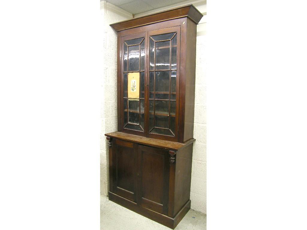 Appraisal: Victorian mahogany bookcase the moulded cornice over two astragal glazed