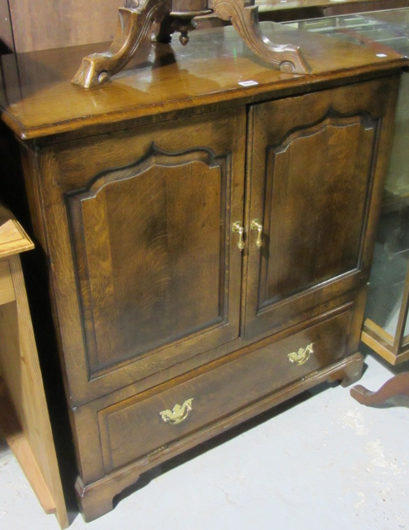 Appraisal: A th century oak television cabinet