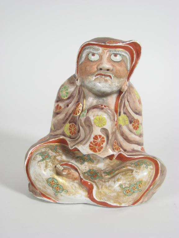 Appraisal: A th Century Japanese Figure seated cross-legged painted rosettes etc