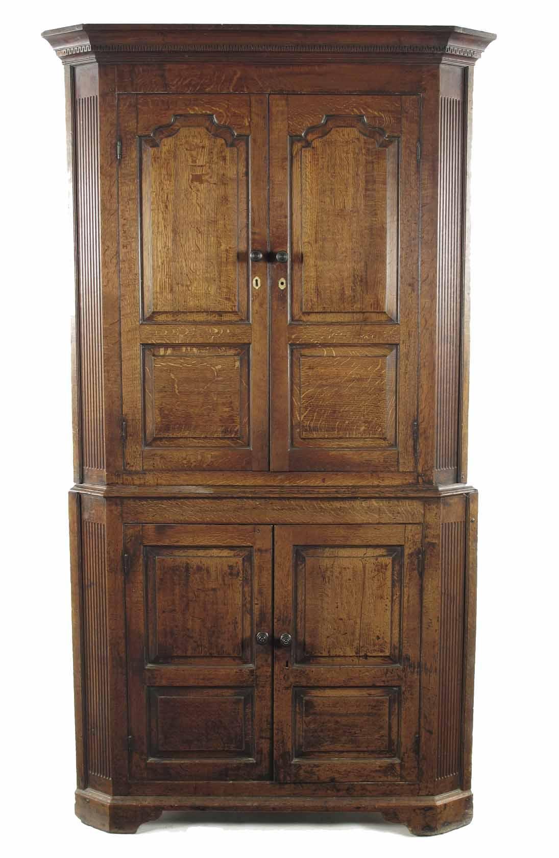 Appraisal: A late George III oak standing corner cupboard