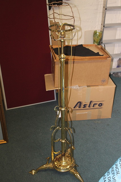 Appraisal: AN ART NOUVEAU BRASS STANDARD LAMP with oil lamp holder