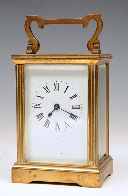 Appraisal: A FRENCH BRASS CARRIAGE TIMEPIECE with white enamel dial and