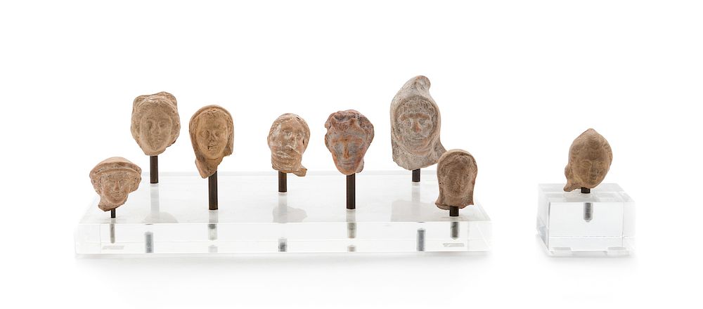 Appraisal: Eight Terra Cotta Votive Heads Eight Terra Cotta Votive Heads