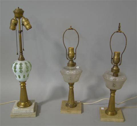 Appraisal: THREE CONVERTED OIL LAMPS Including a pair with frosted glass