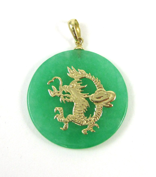 Appraisal: CHINESE JADE AND FOURTEEN KARAT GOLD PENDANT with a round