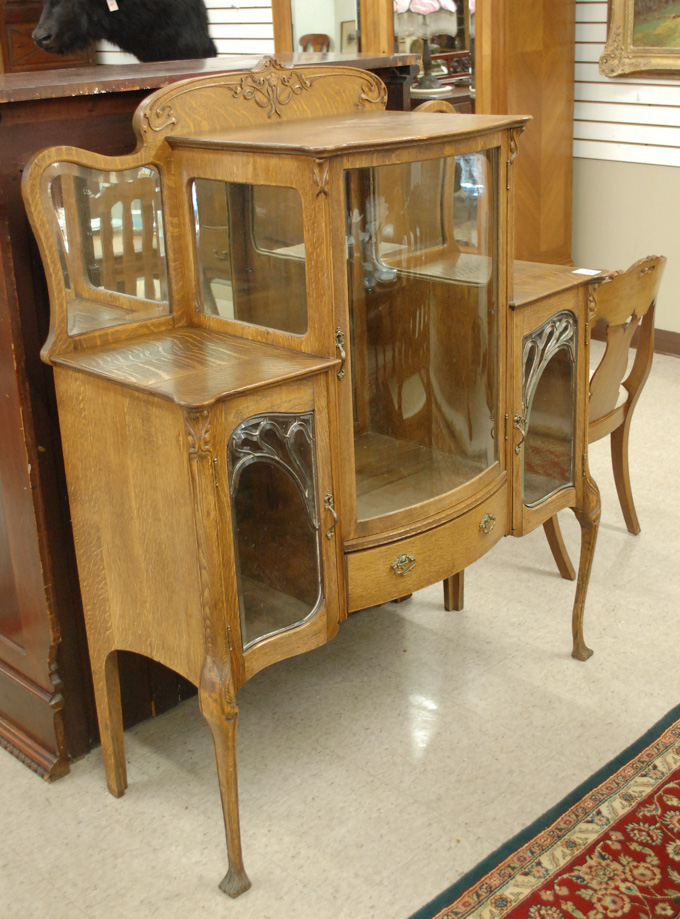 Appraisal: LATE VICTORIAN OAK CURVED AND LEADED GLASS CHINA BUFFET American