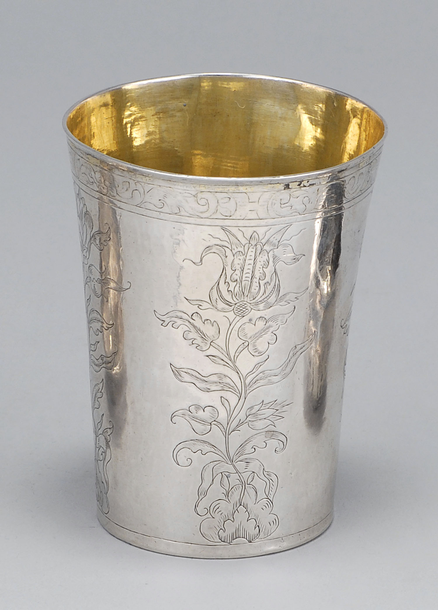 Appraisal: CONTINENTAL SILVER TUMBLER th CenturyEngraved with floral design Marked on