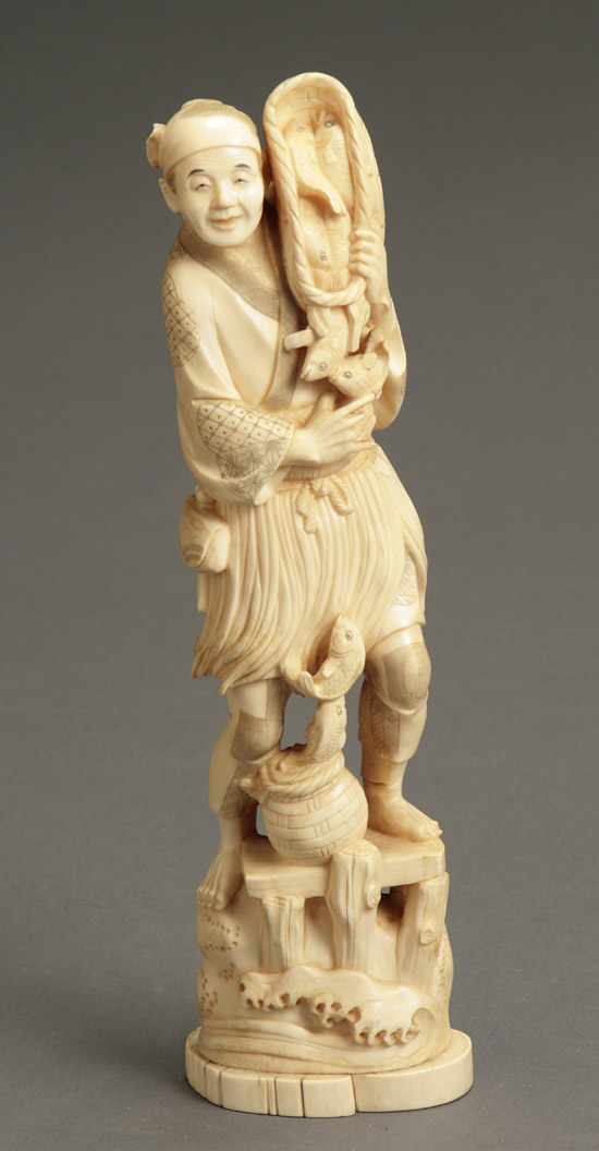 Appraisal: Japanese Ivory Okimono of a Fisherman with His Catch Signed