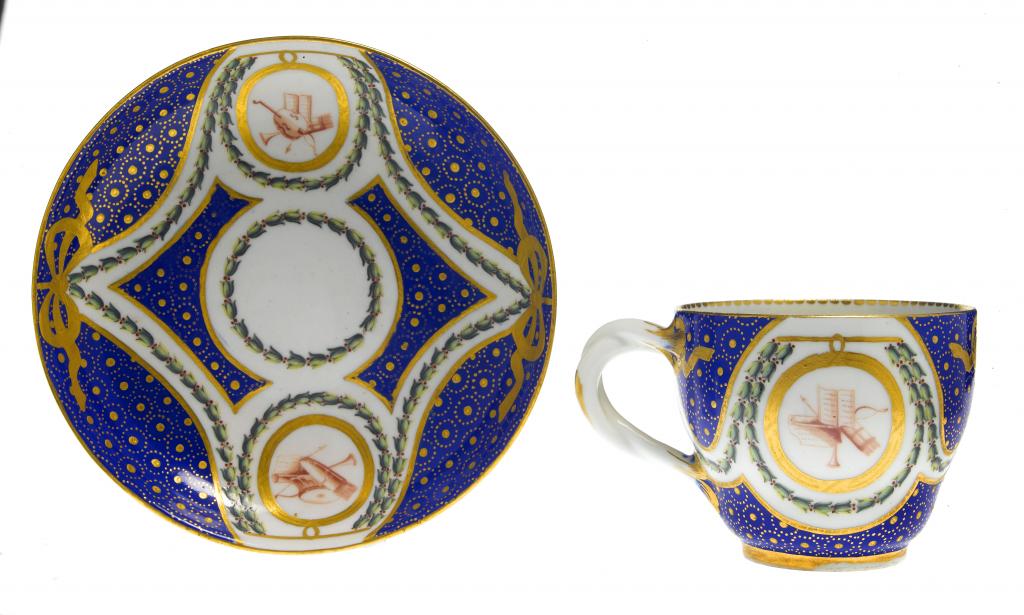 Appraisal: A CHELSEA-DERBY CUP AND SAUCER with entwined handle painted in